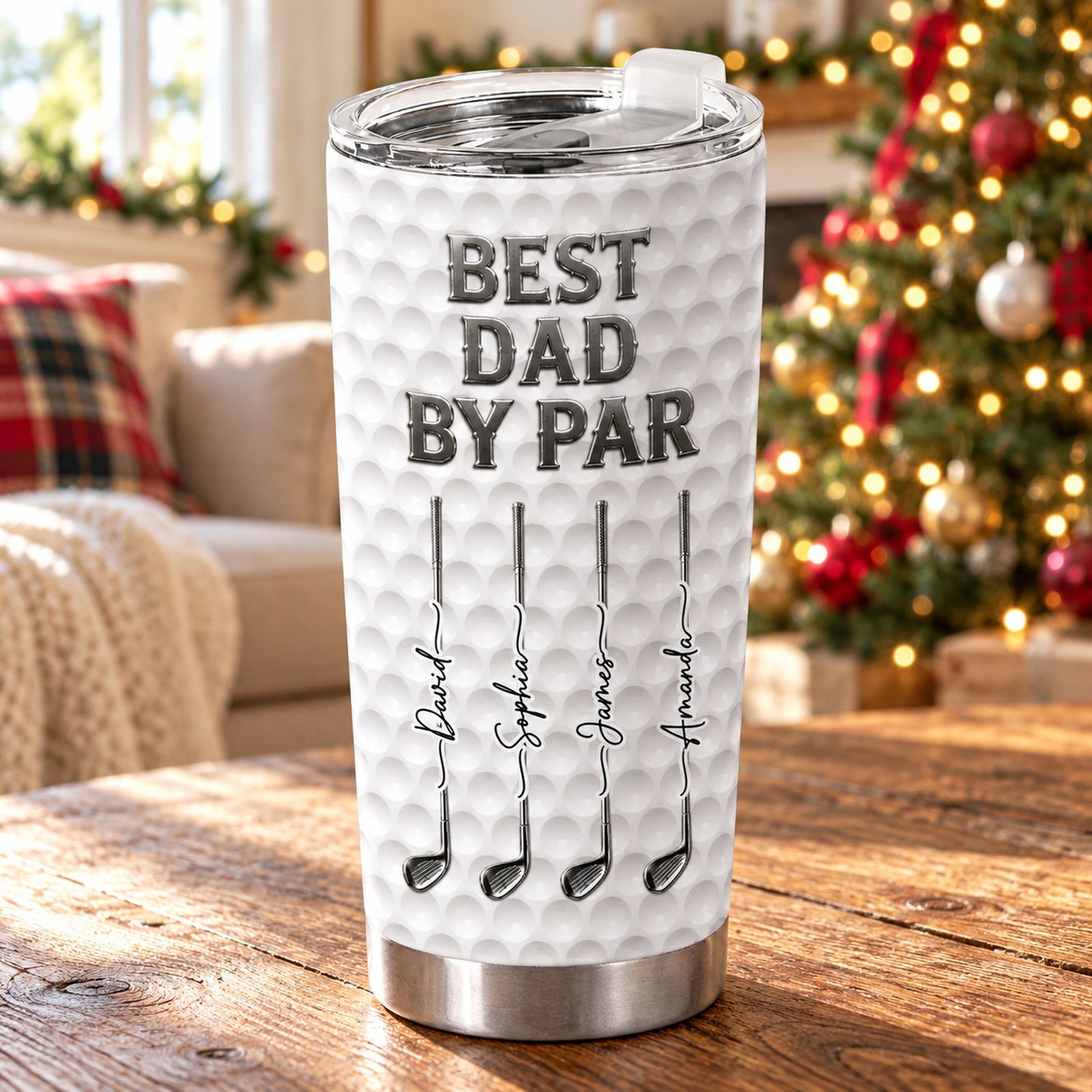 Personalized Best Dad By Par golf 20oz fat tumbler on a table by a Christmas tree