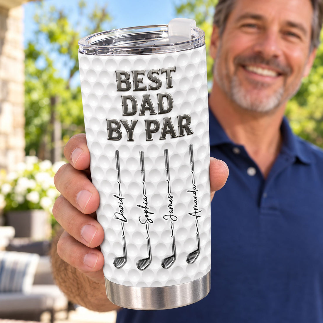 Dad holding his personalized Best Dad By Par golf 20oz tumbler outdoors