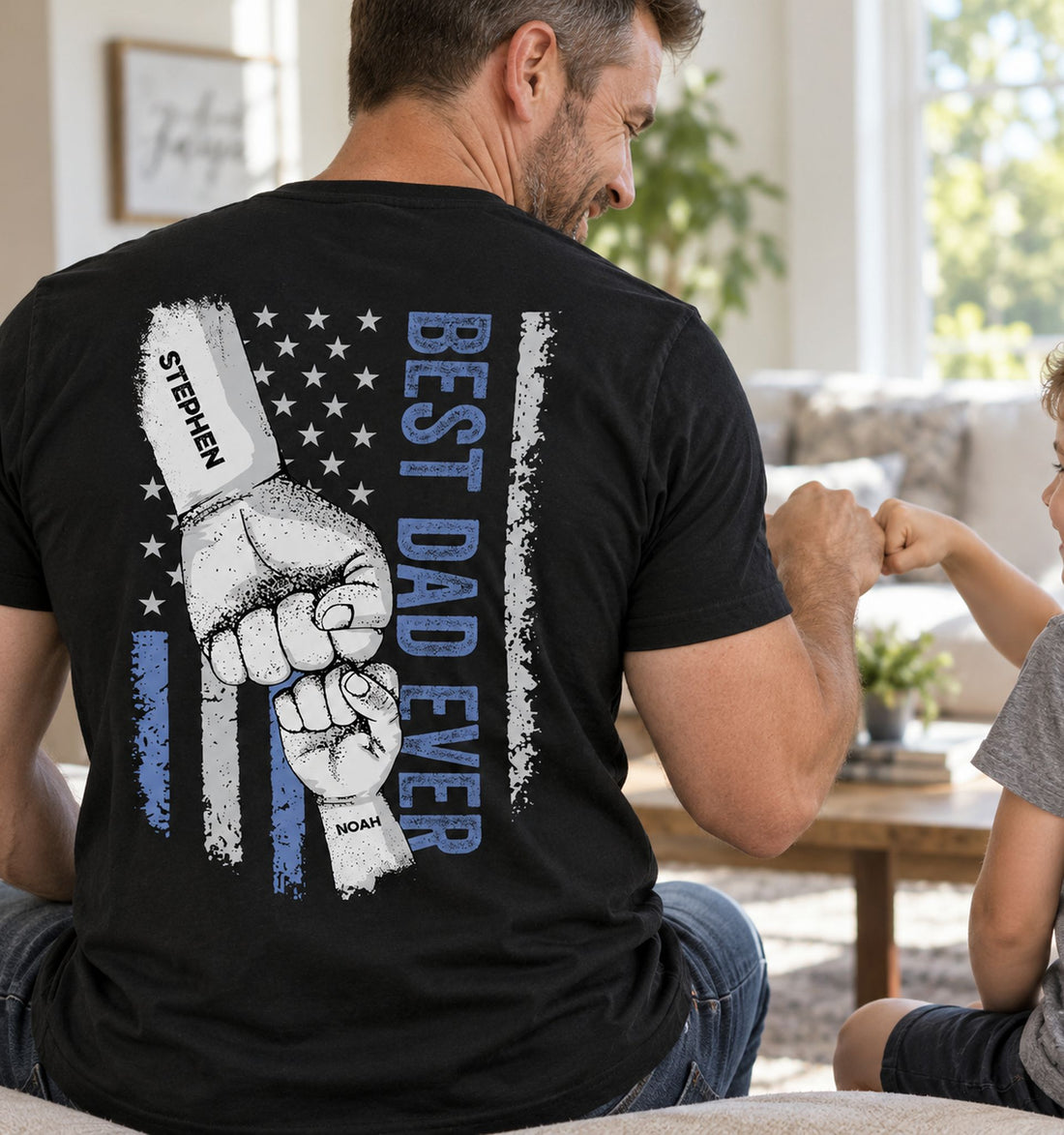 Dad wearing Best Dad Ever personalized fist bump back printed black t-shirt at home with kid