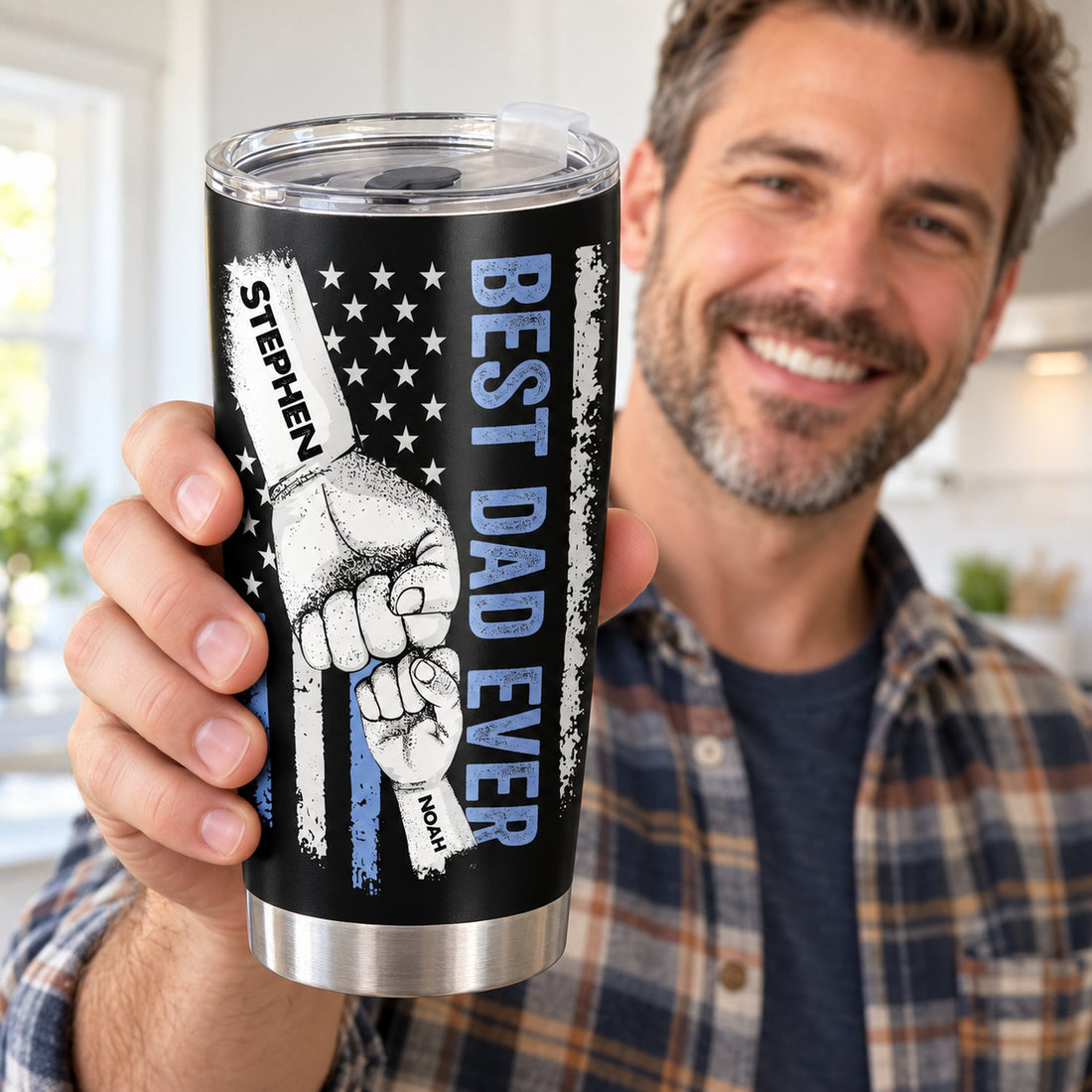 Happy dad holding his personalized Best Dad Ever fist bump 20oz stainless steel tumbler