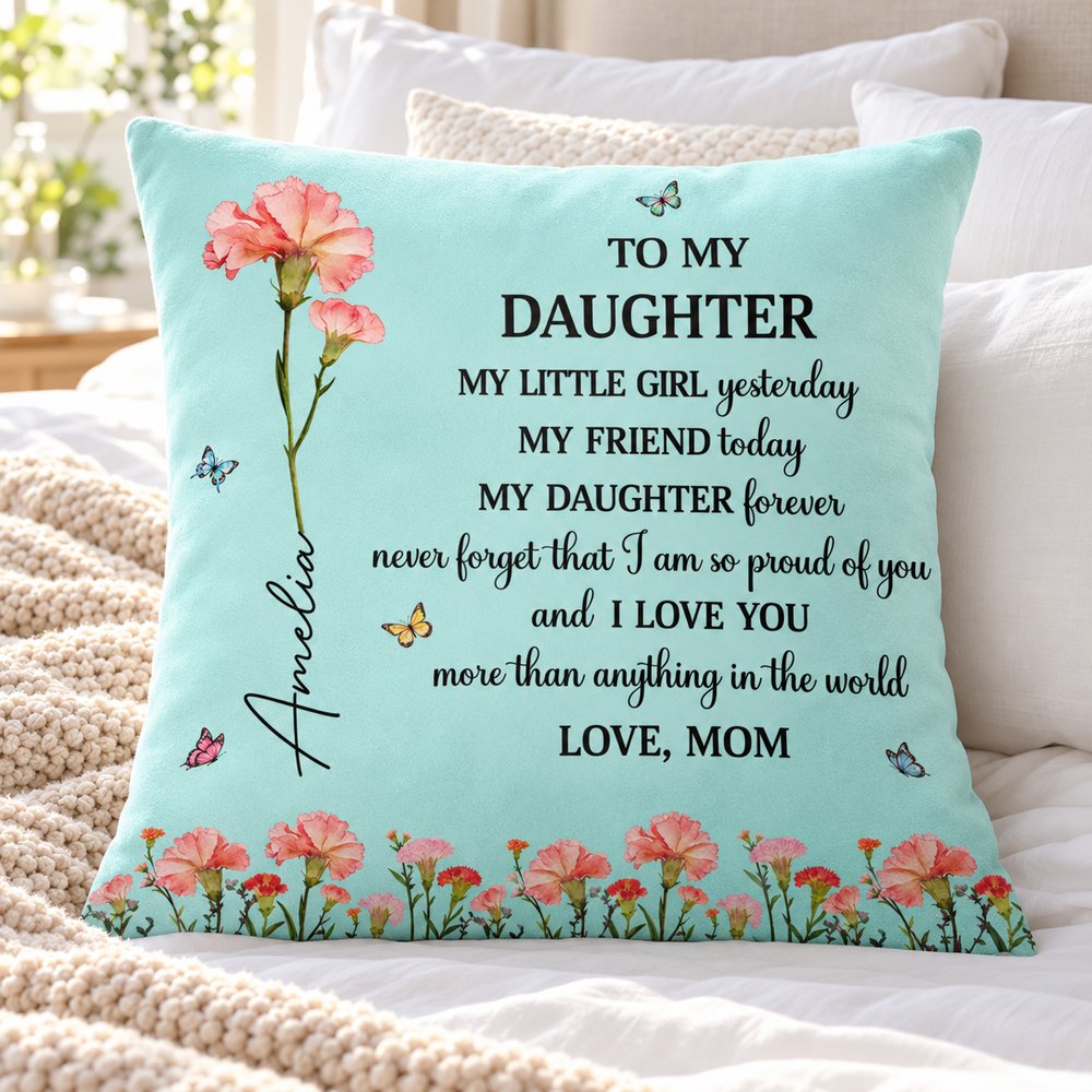 Custom daughter birth flower throw pillow styled on a cozy bed