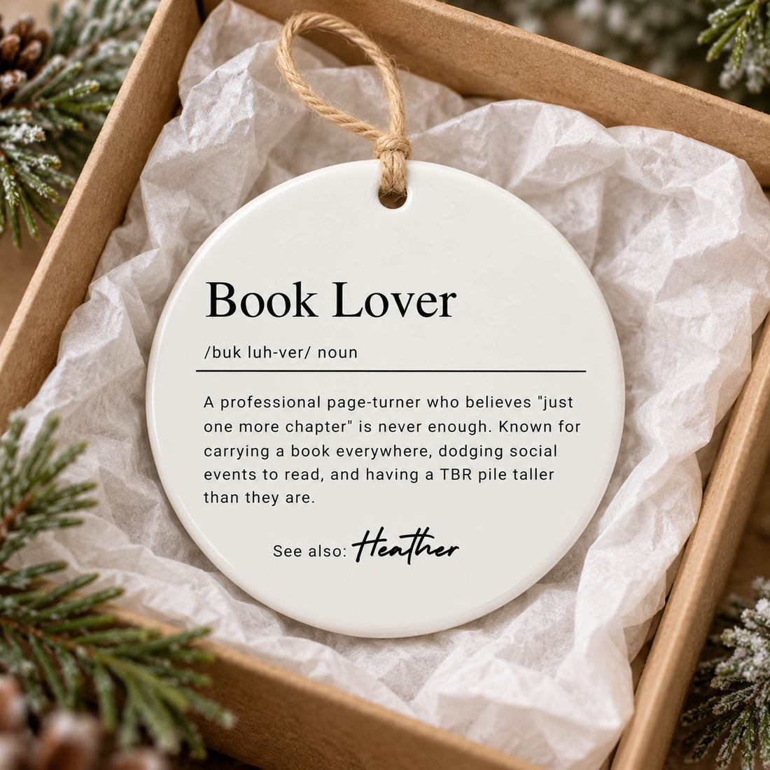 Book Lover personalized ceramic ornament nestled in a gift box with white tissue paper