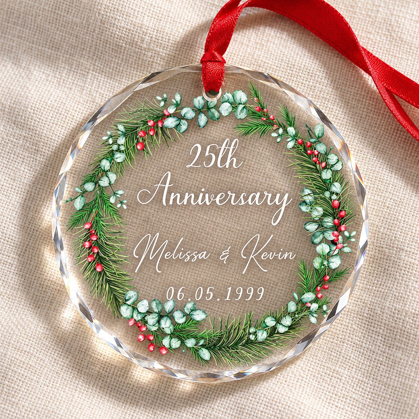 Close-up detail of beveled glass edge and greenery wreath print on anniversary ornament