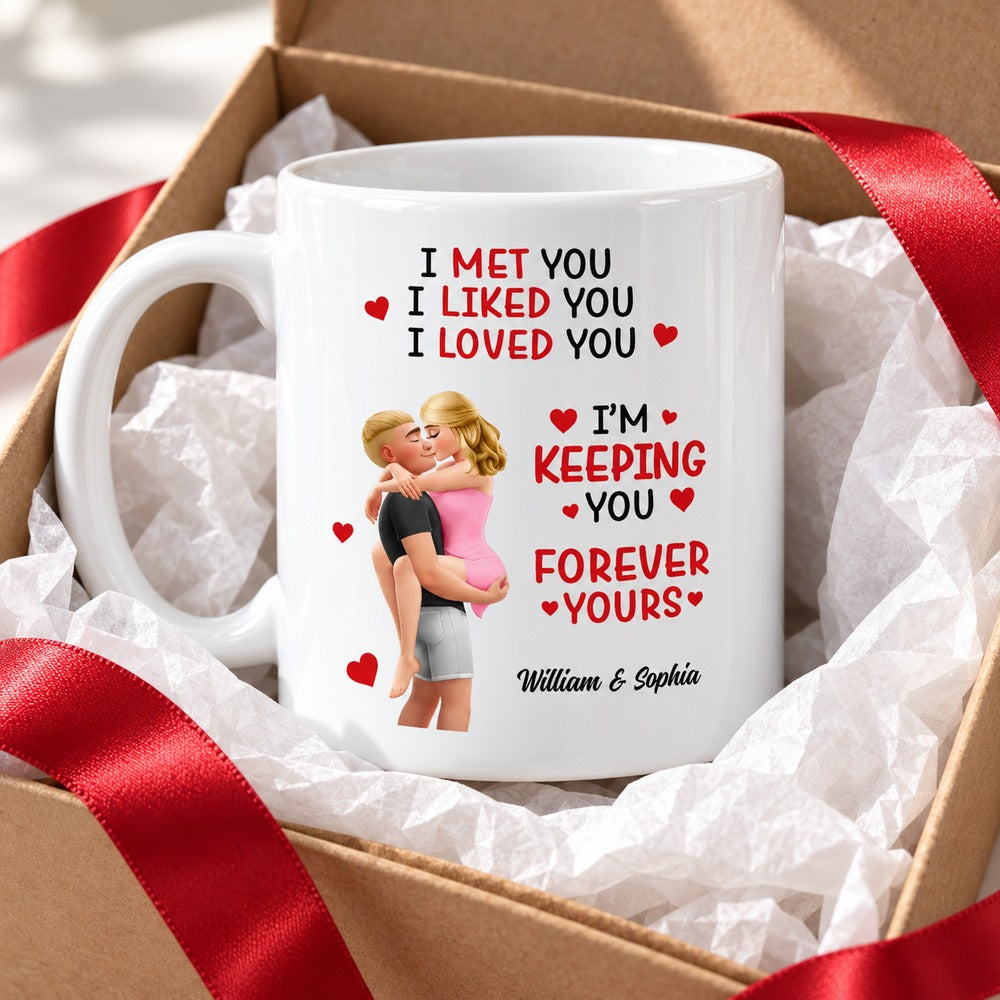 Personalized couple mug in an open gift box with tissue paper and red ribbon