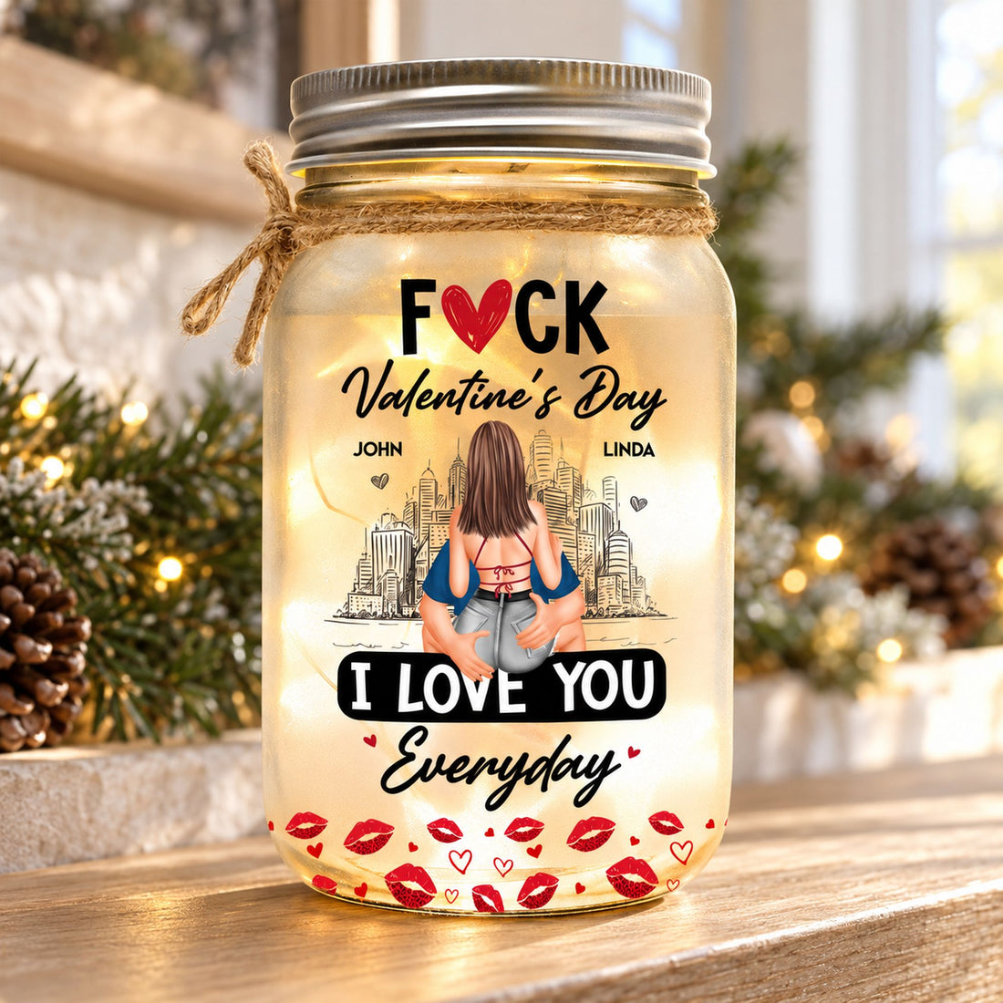 Personalized couple mason jar light glowing on a cozy holiday mantel with pine garland
