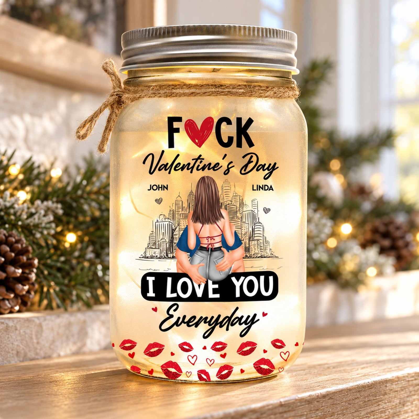 Personalized couple mason jar light glowing on a cozy holiday mantel with pine garland