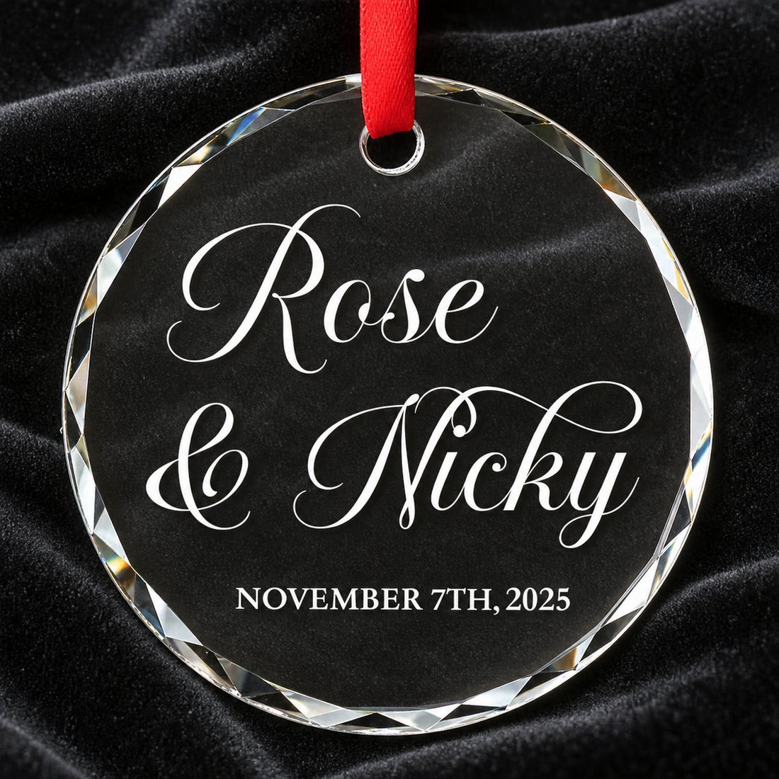 Macro closeup of beveled edge and white script on personalized circle glass couple ornament