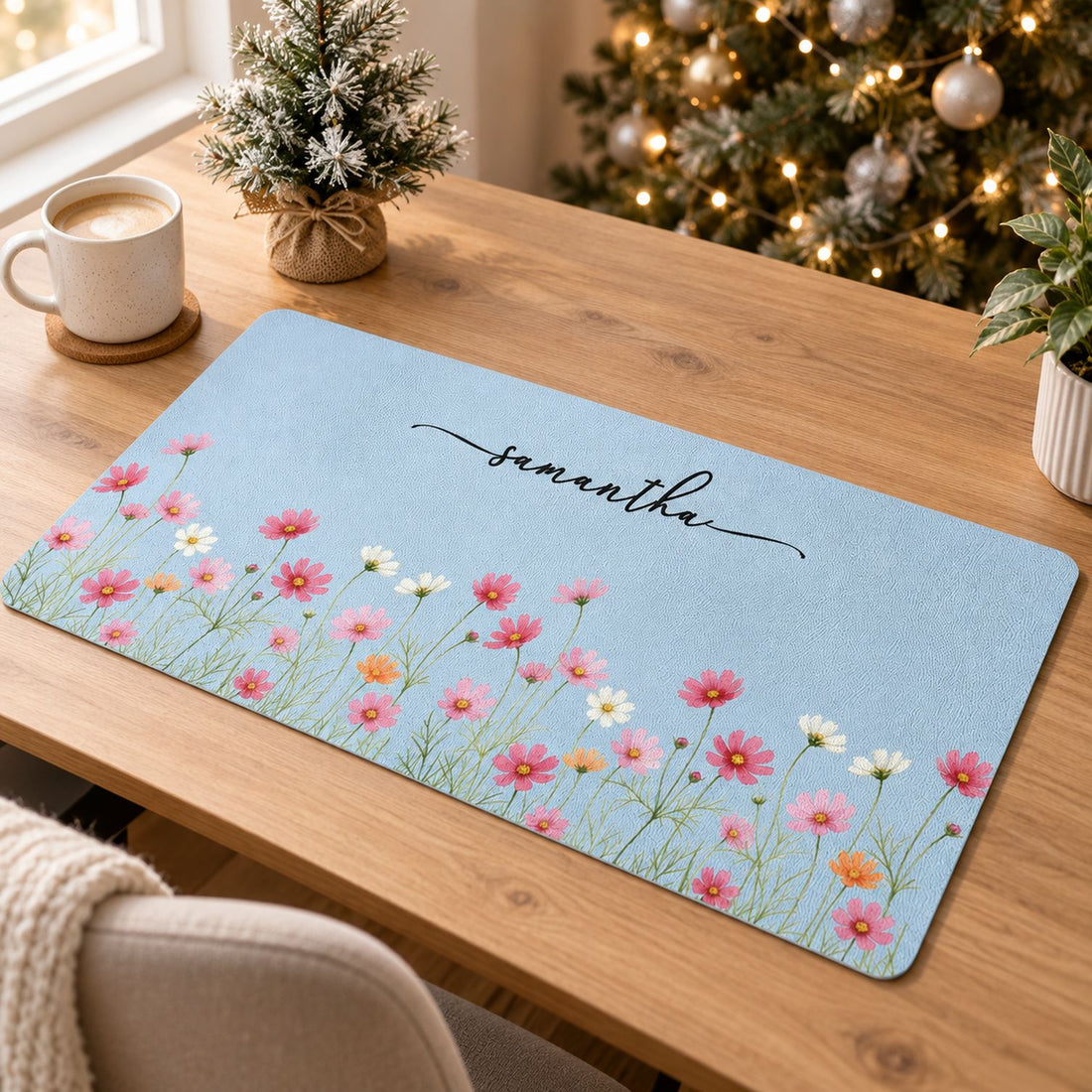 Personalized birth flower desk mat on a bright home office desk with holiday decor