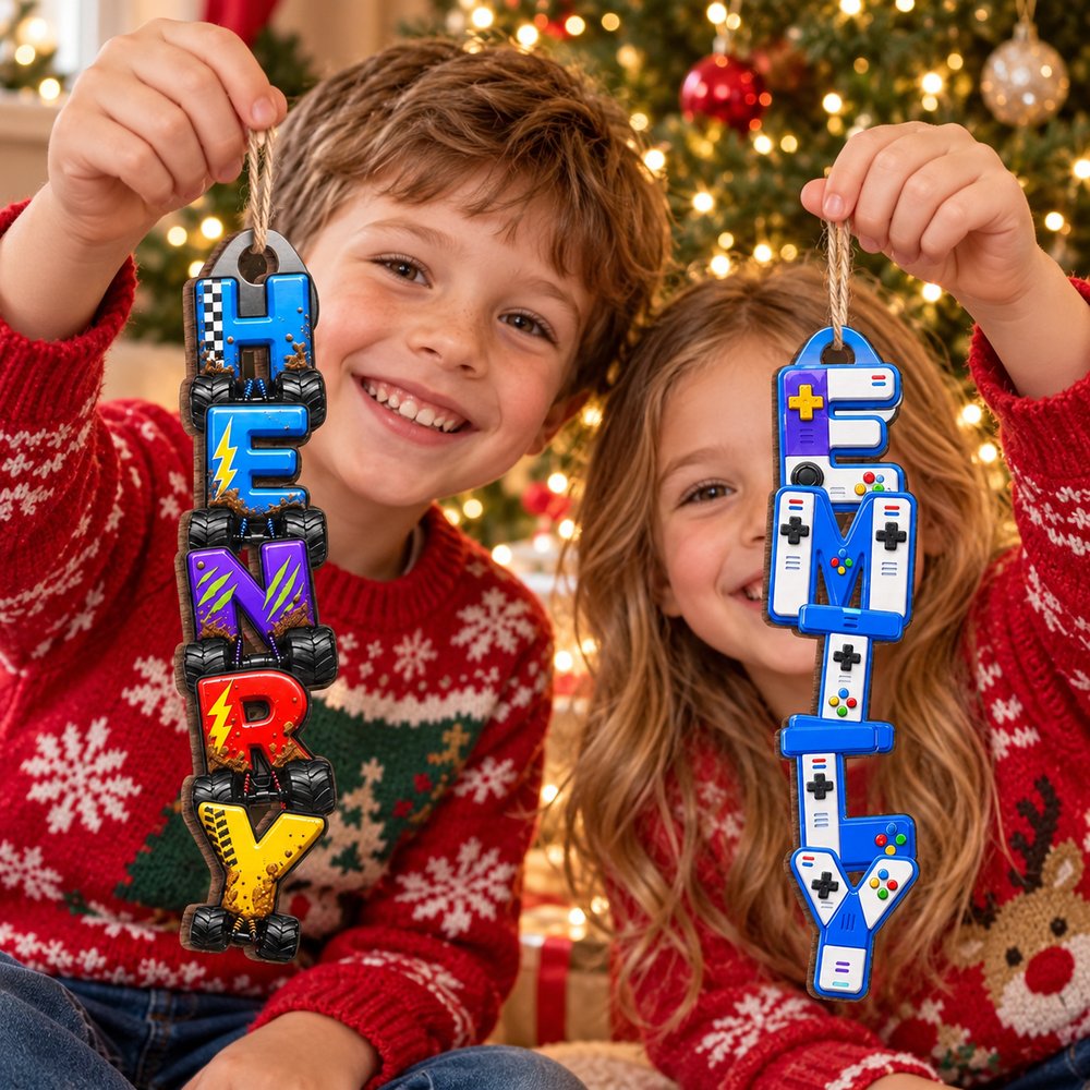 Brother and sister holding their custom vertical letter wooden Christmas ornaments near the holiday tree