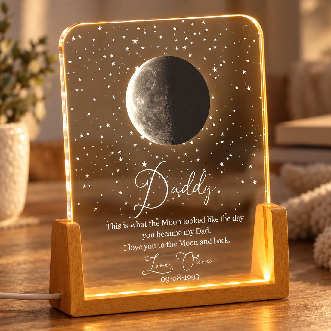 Close-up detail of UV printed moon phase, stars, and wooden LED base on Dad night light