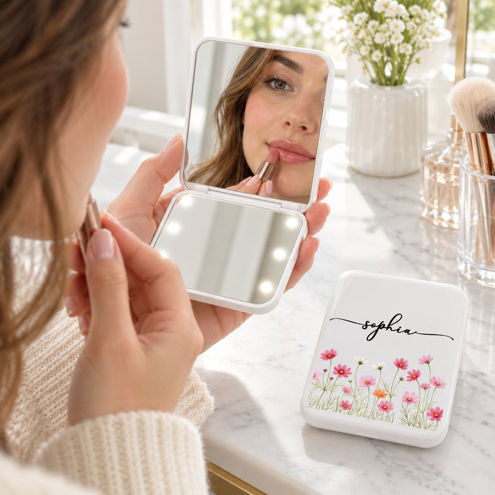 Woman holding open Personalized LED Pocket Mirror with glowing lights for makeup touch-up