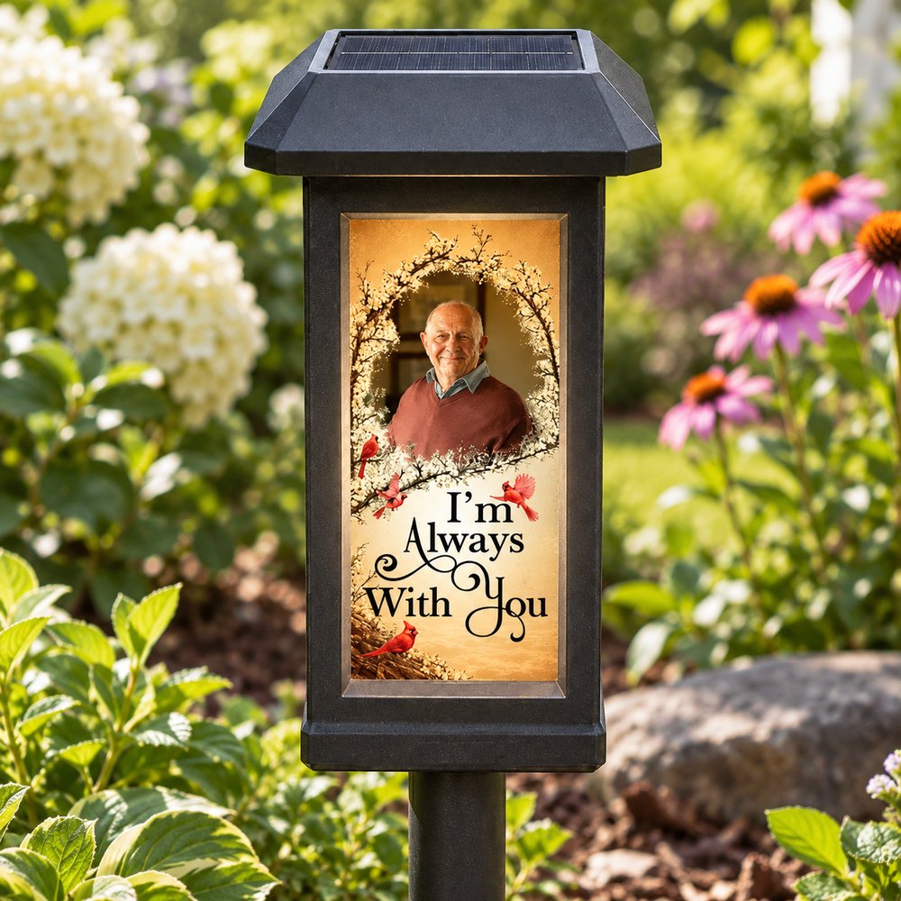 Close-up of custom photo and cardinal print on personalized memorial solar garden light