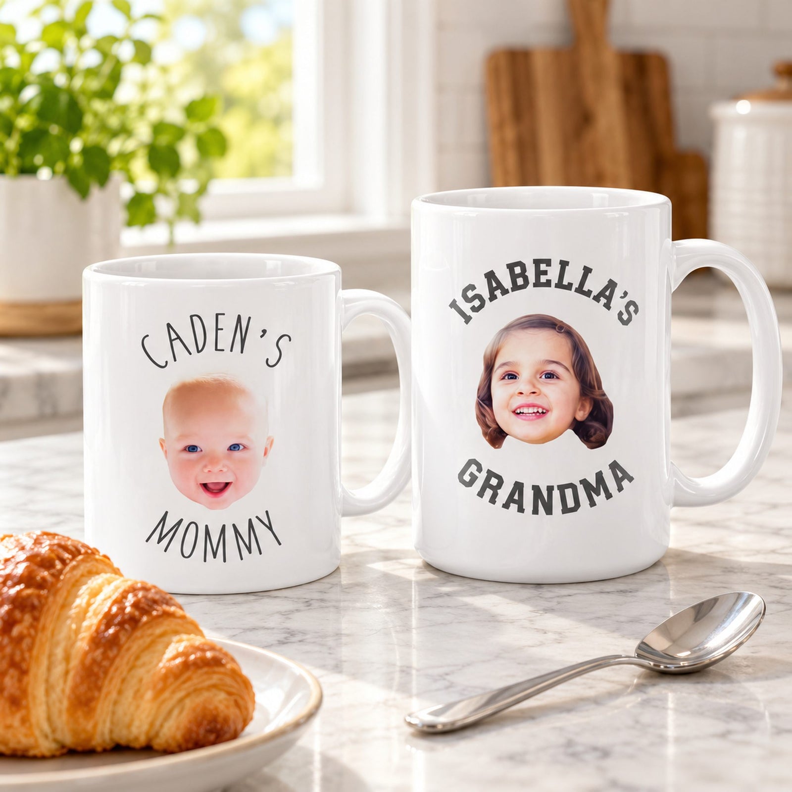 11oz and 15oz custom baby face ceramic mugs on counter next to pastry for scale