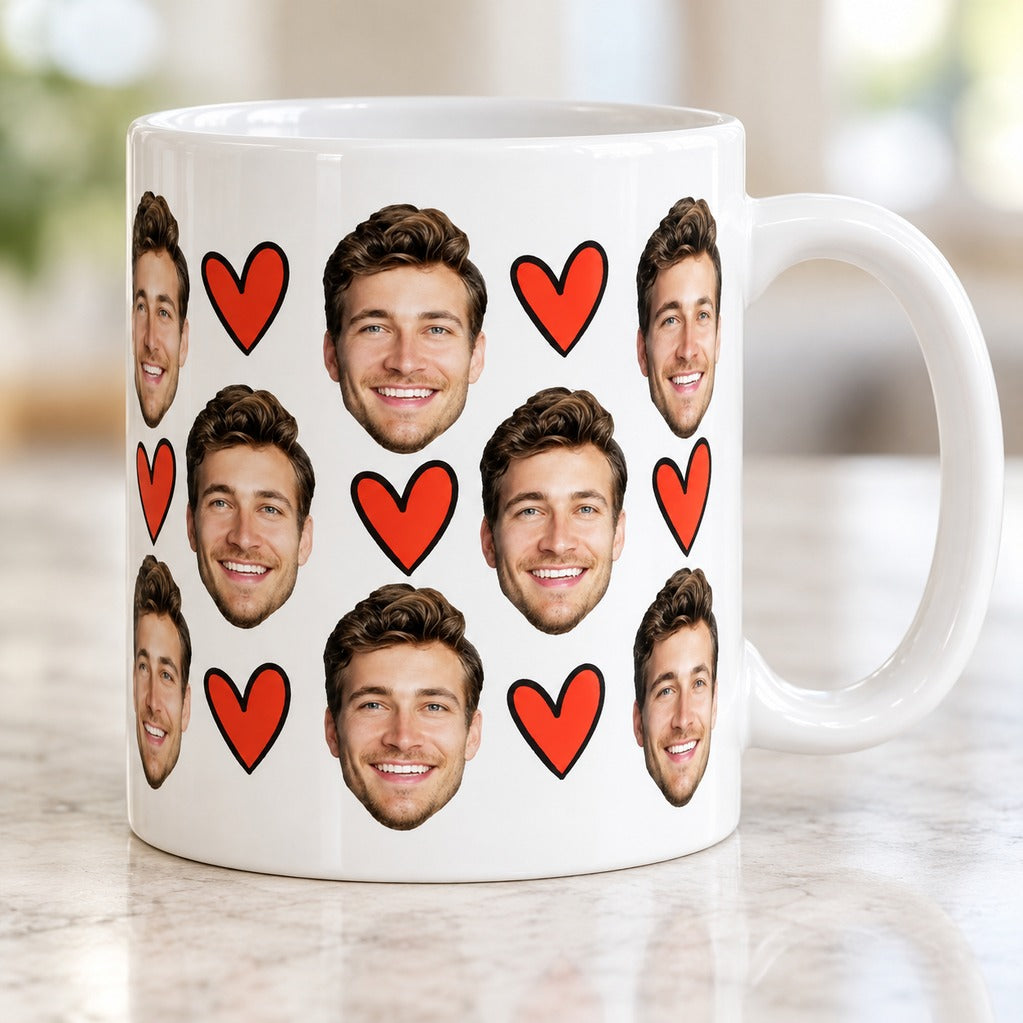 Close-up detail of custom face and red heart print on glossy white ceramic mug
