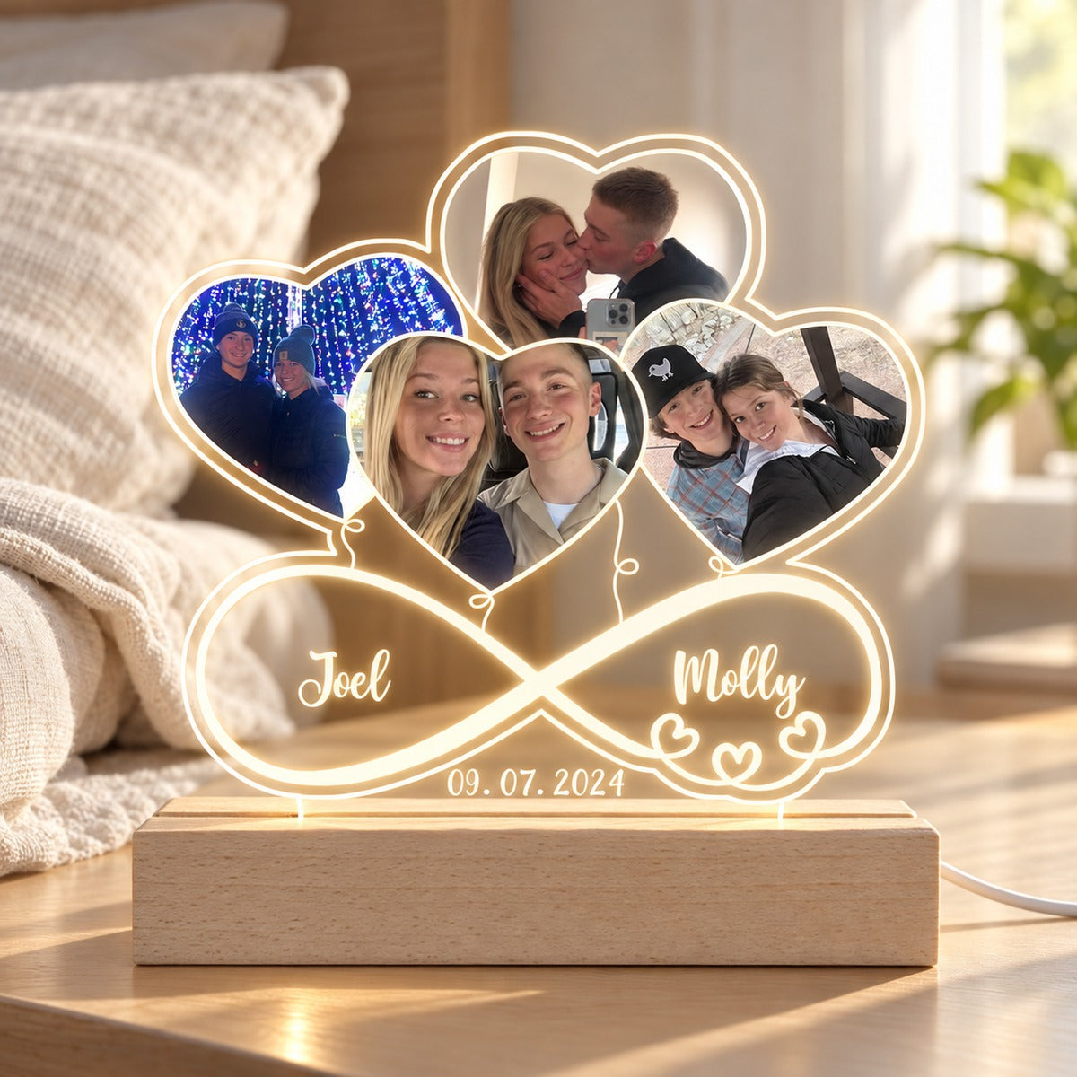 Personalized couple photo infinity LED night light glowing on bedroom nightstand