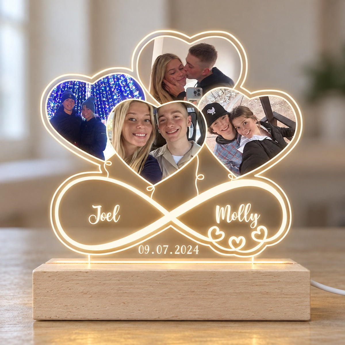 Close-up detail of personalized couple infinity heart acrylic LED plaque and wood base