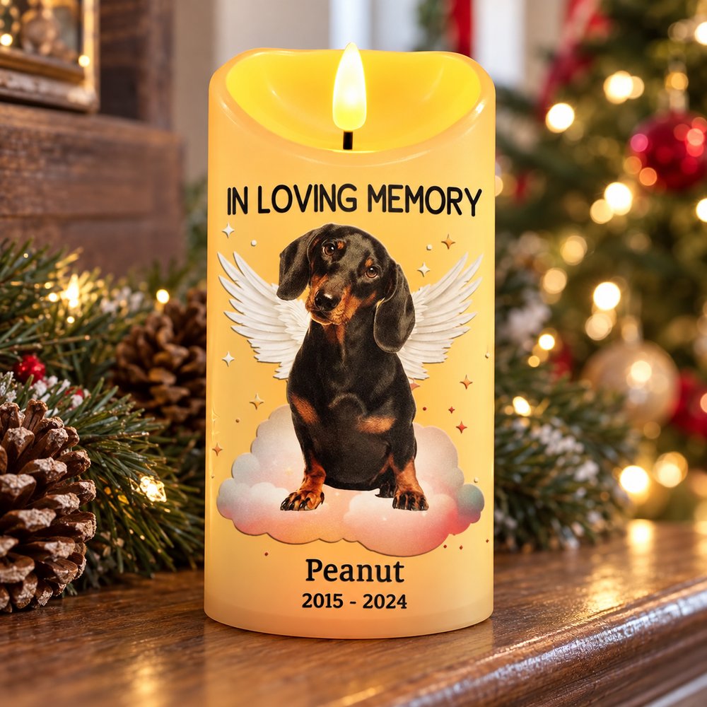 Personalized pet memorial LED candle with dog angel wings on a holiday fireplace mantel