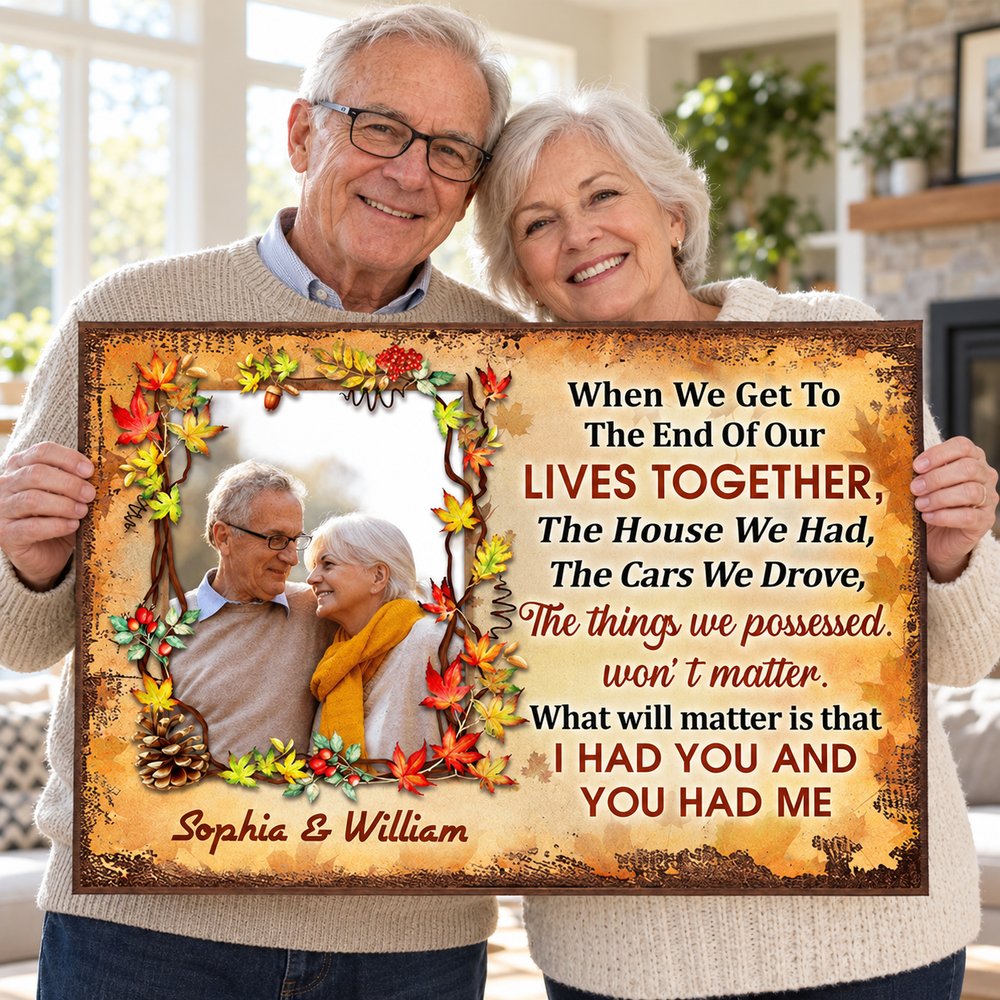 Happy older couple holding their personalized anniversary autumn poster gift