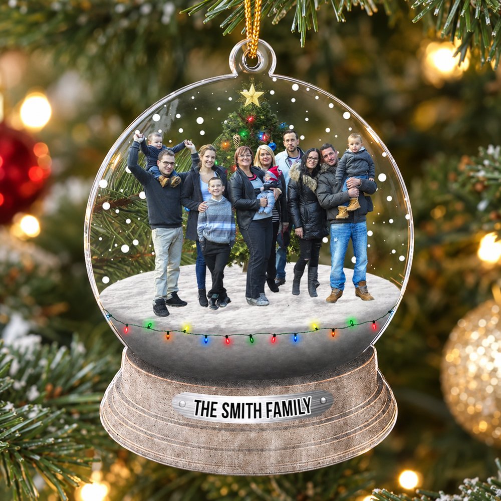 Custom photo family Christmas acrylic ornament hanging on a bright Christmas tree branch