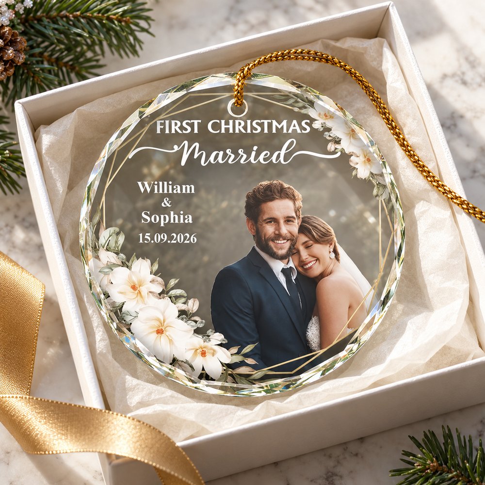 Custom First Christmas Married glass ornament presented in an open gift box with ribbon