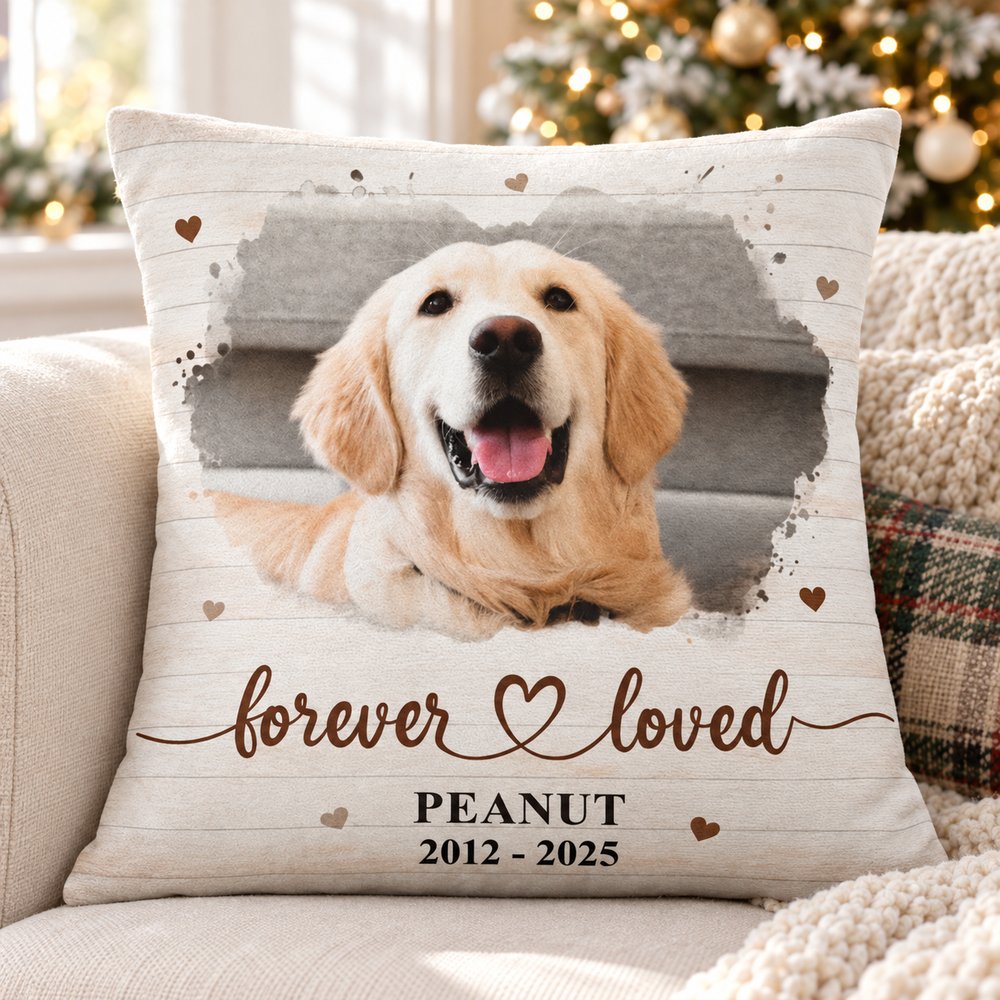 Custom photo dog memorial pillow on a cozy sofa with holiday tree in soft background