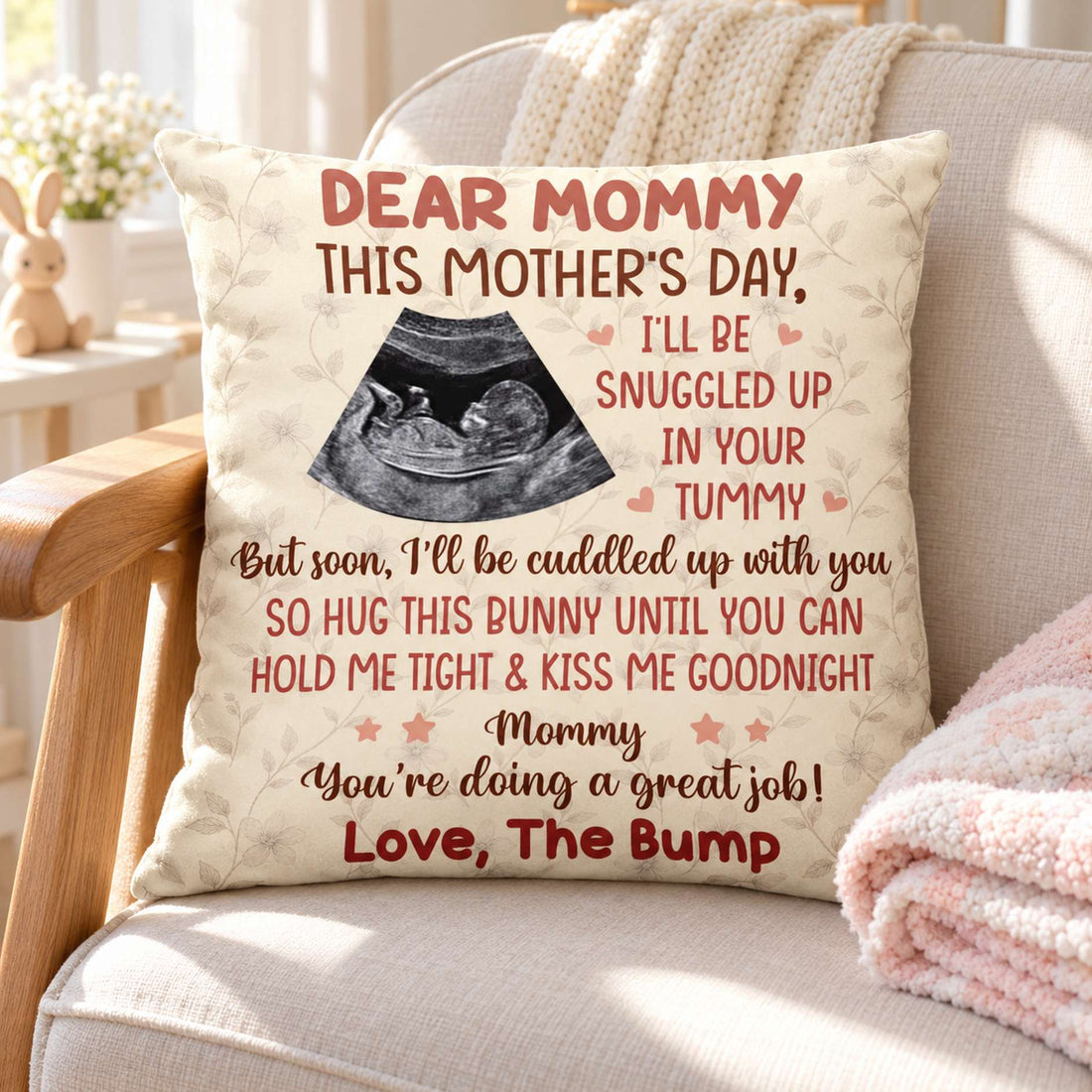 Custom baby bump sonogram throw pillow displayed on a bright nursery rocking chair
