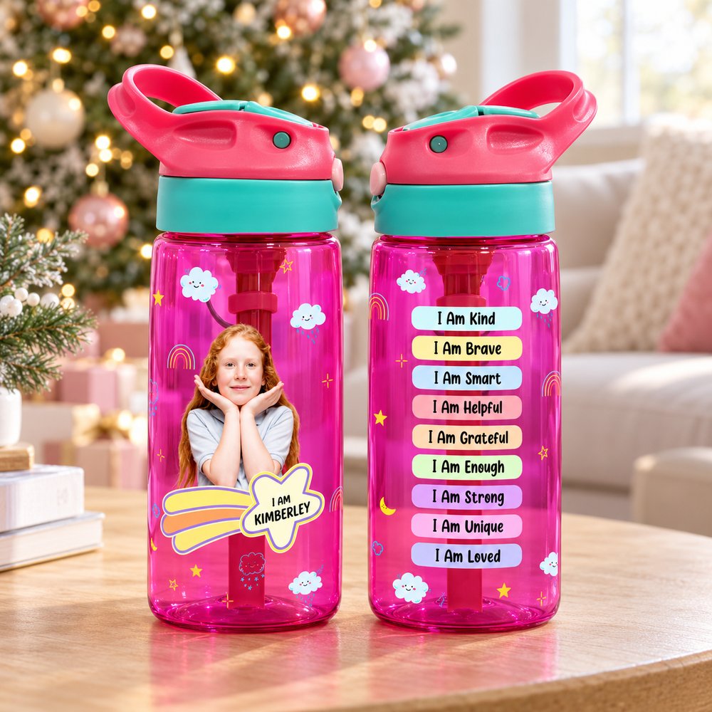 Personalized kids water bottles with straw on table in front of Christmas tree