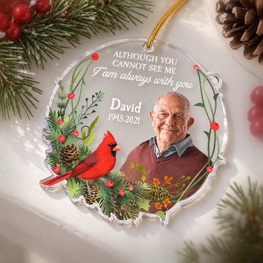 Personalized sympathy acrylic ornament resting flat on a bright holiday mantelpiece with pine