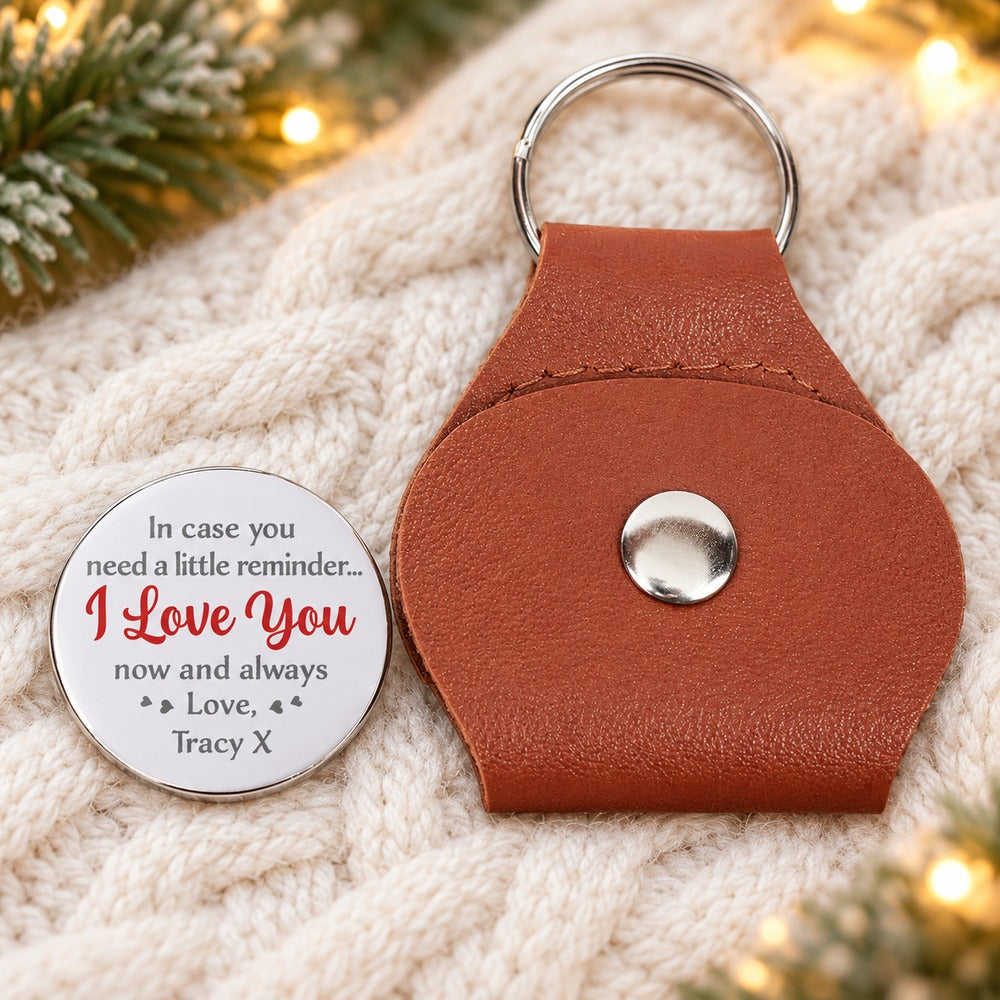 Personalized leather pocket hug and Tracy X reminder coin on cream knit with holiday lights