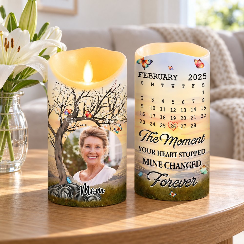 Personalized sympathy LED candle displayed on a side table with white flowers