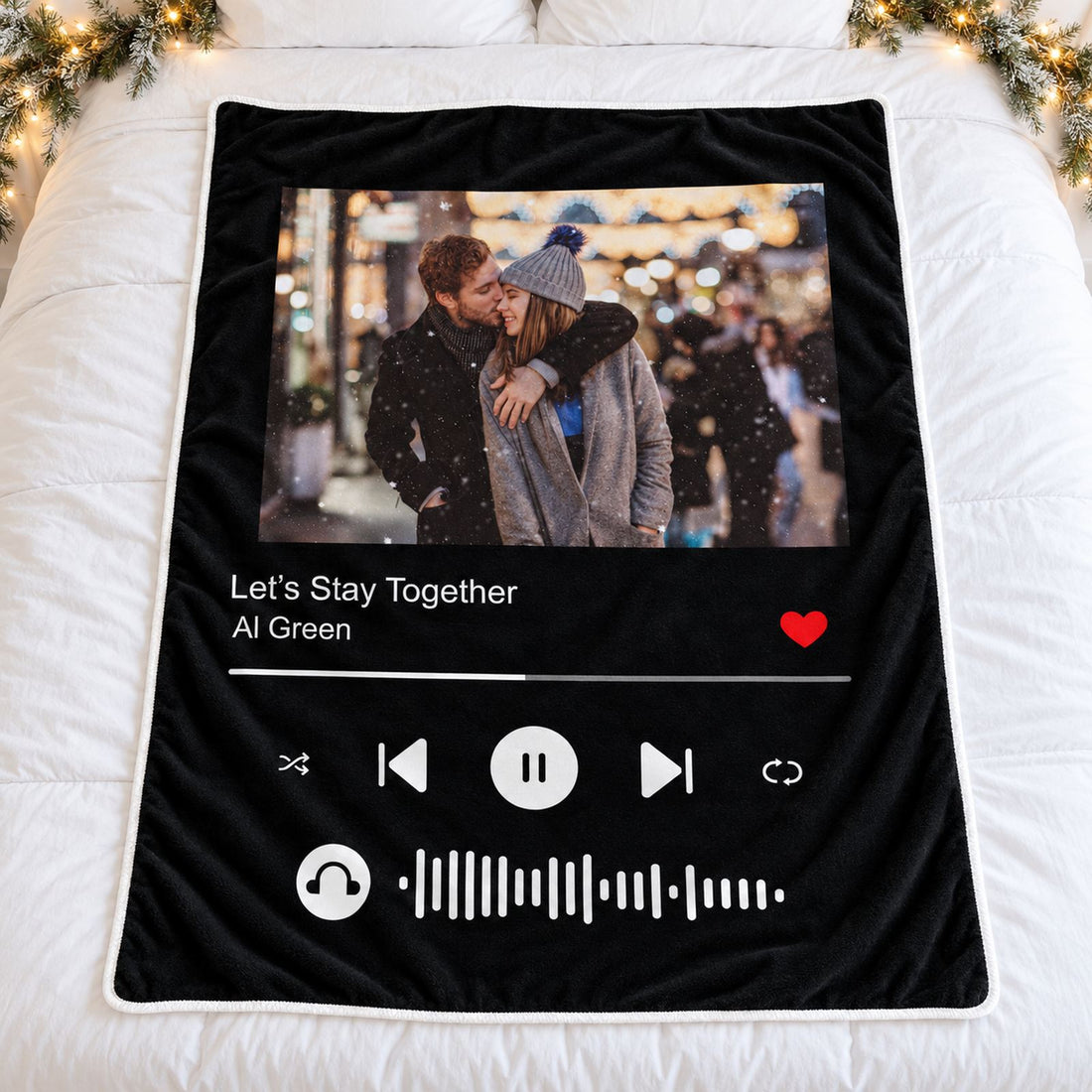 Custom song photo blanket for couples spread flat on a cozy holiday bed