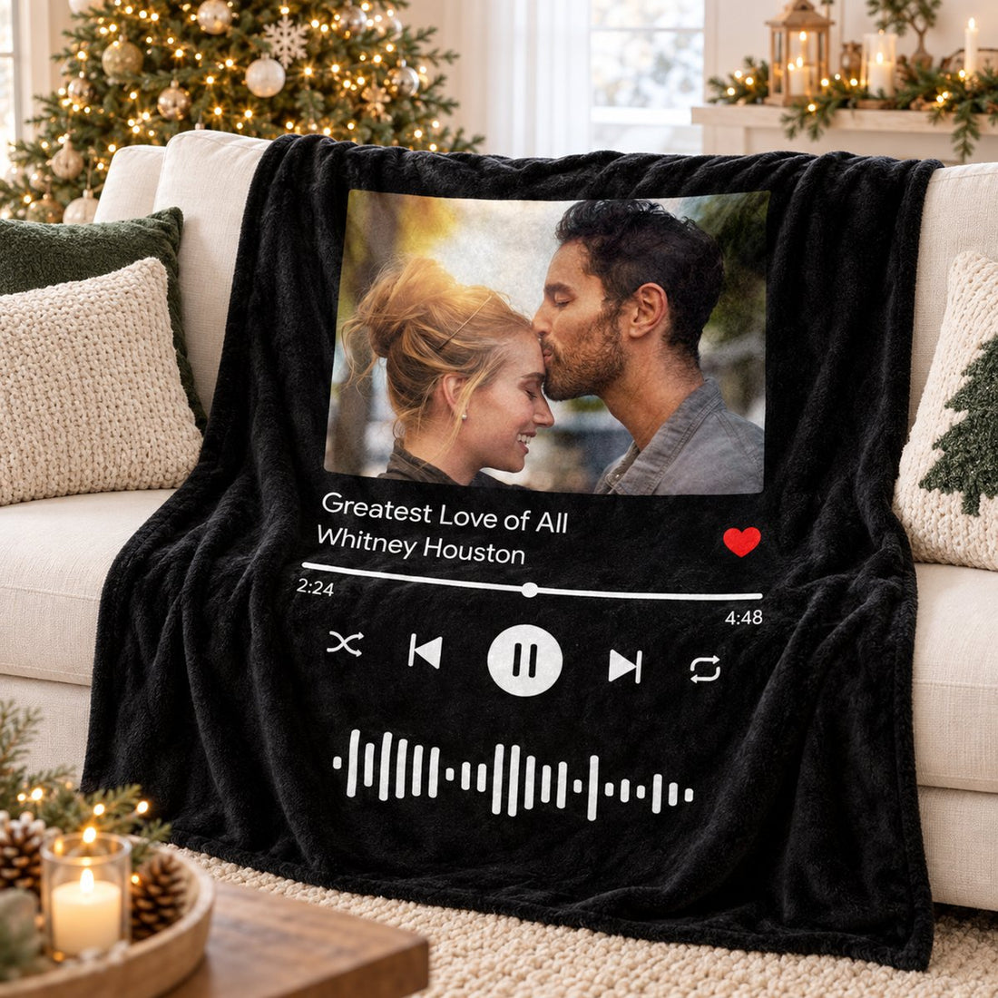 Personalized couple song fleece blanket draped on a sofa with holiday tree in background