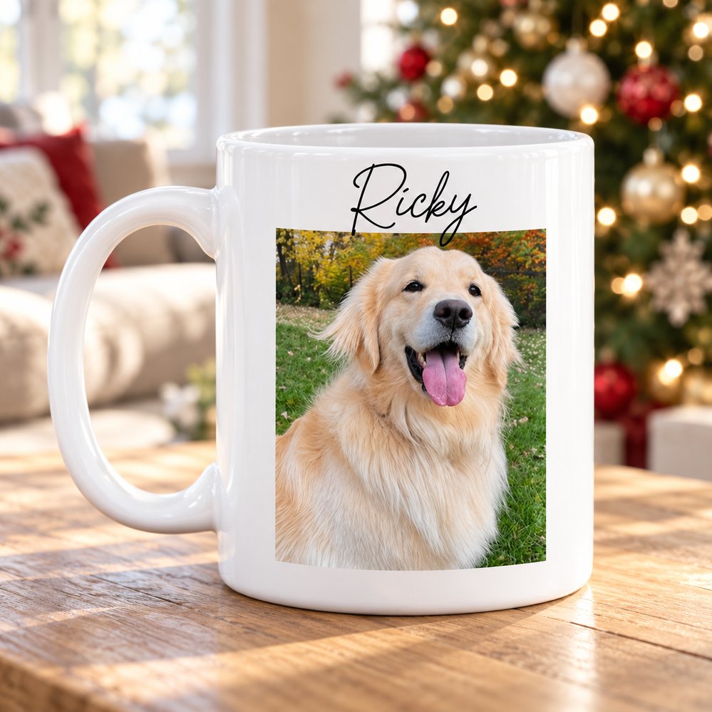 Custom pet photo ceramic mug with dog picture and name on table near Christmas tree