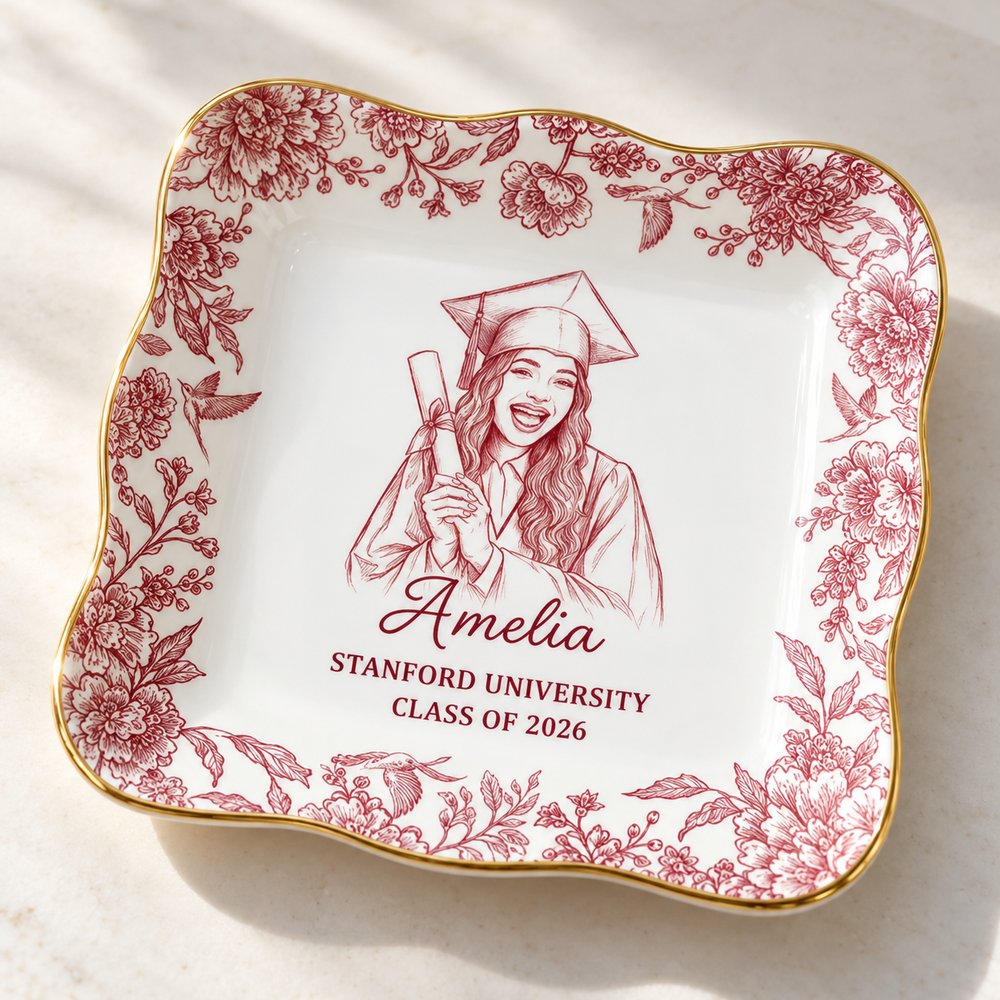 Close-up of custom graduation jewelry dish showing gold rim and fine toile sketch print