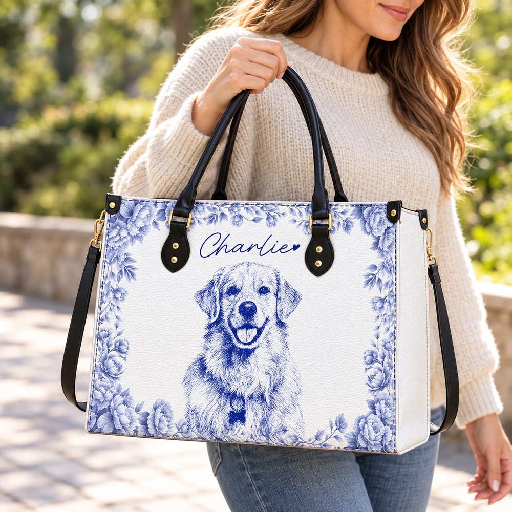 Woman carrying custom pencil sketch dog portrait leather handbag outdoors