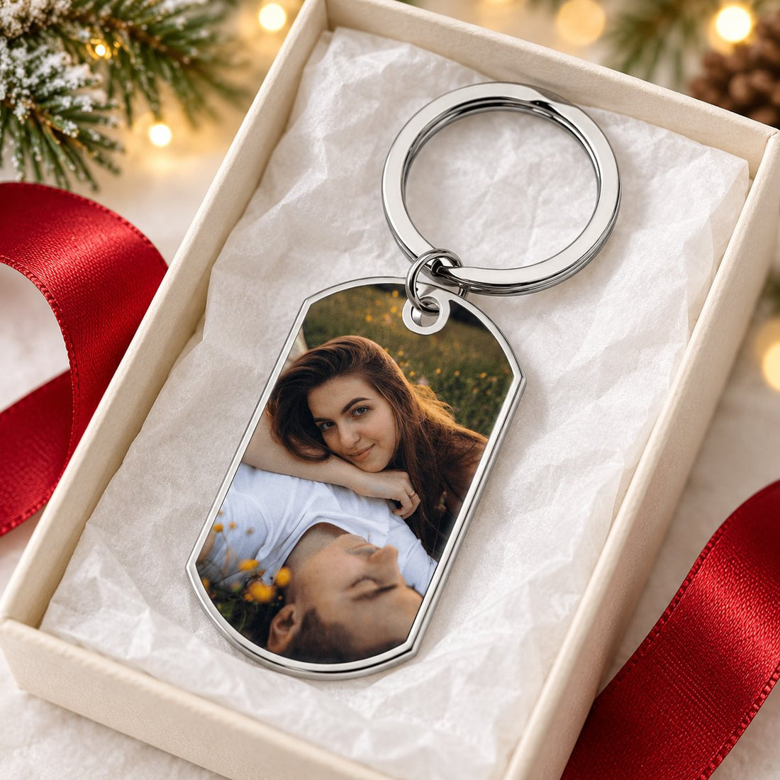 Personalized couple photo stainless steel keychain in an open holiday gift box with ribbon