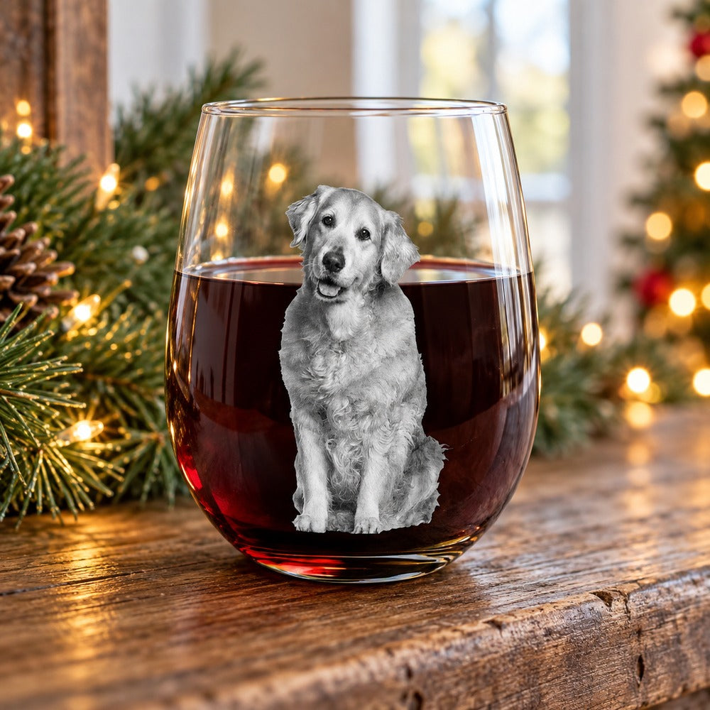 Personalized dog portrait stemless wine glass with red wine on holiday mantel with pine greenery