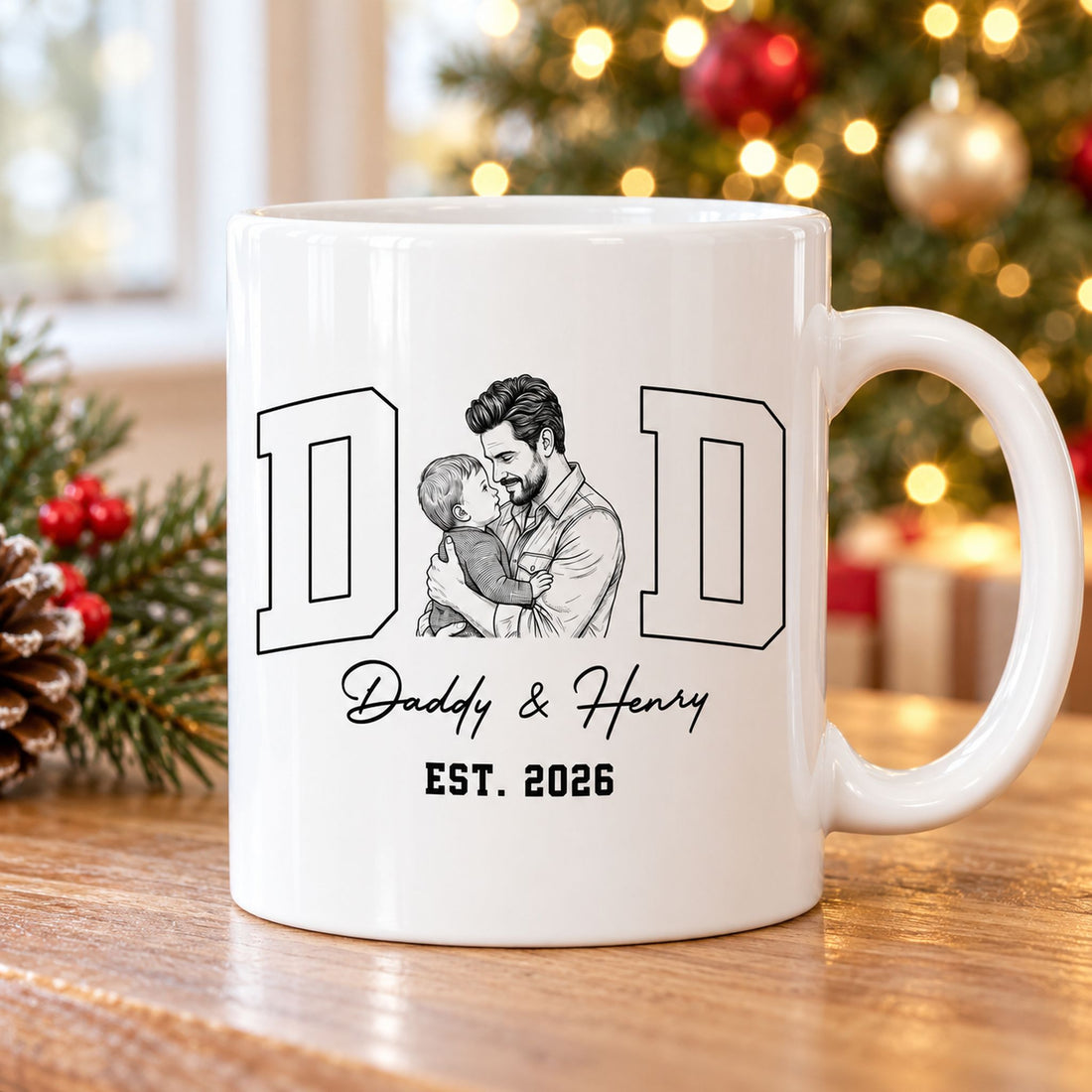 Personalized Daddy and Henry sketch mug on a wooden table near a holiday Christmas tree