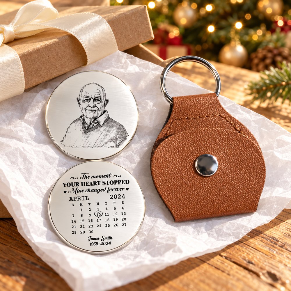 Personalized memorial leather pocket hug and sketch coin next to a holiday gift box with ribbon