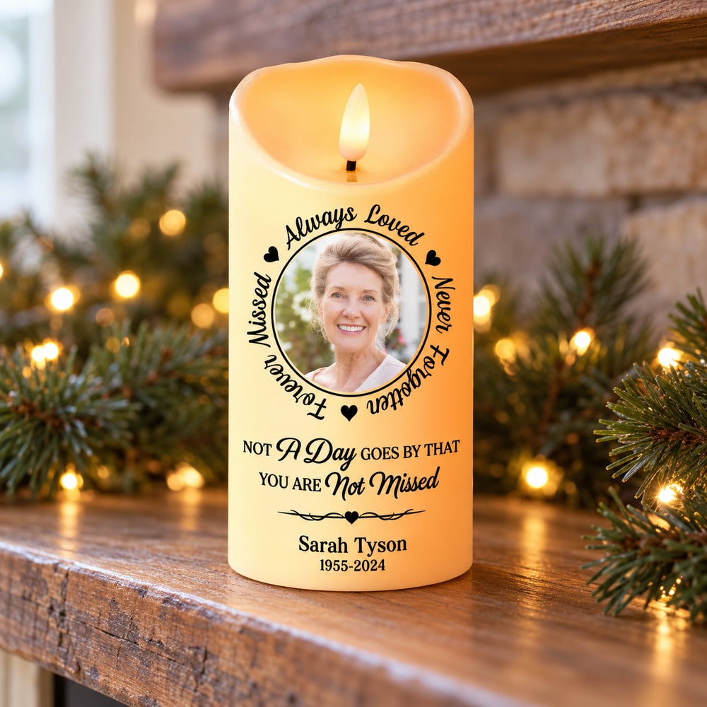 Personalized memorial LED candle for Sarah Tyson on a holiday mantel with pine greenery