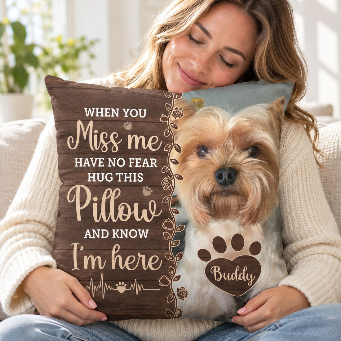 Woman hugging custom photo pet memorial pillow on a bright cozy sofa