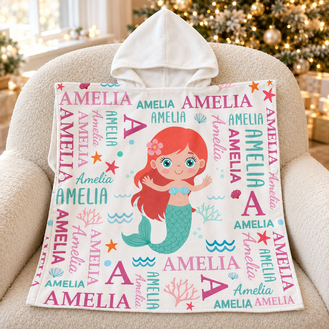 Custom name mermaid kids hooded towel displayed by a Christmas tree as a holiday gift