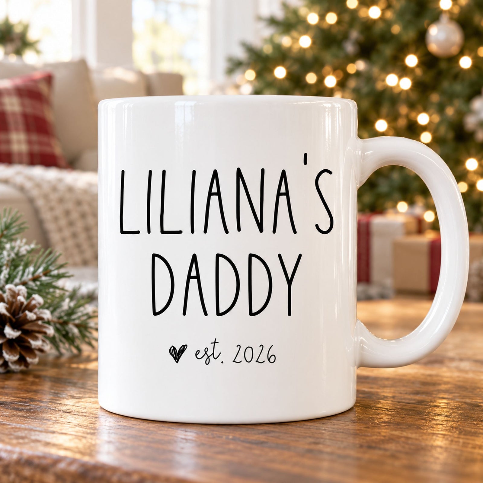 Personalized Daddy est 2026 ceramic mug on table with Christmas tree in background
