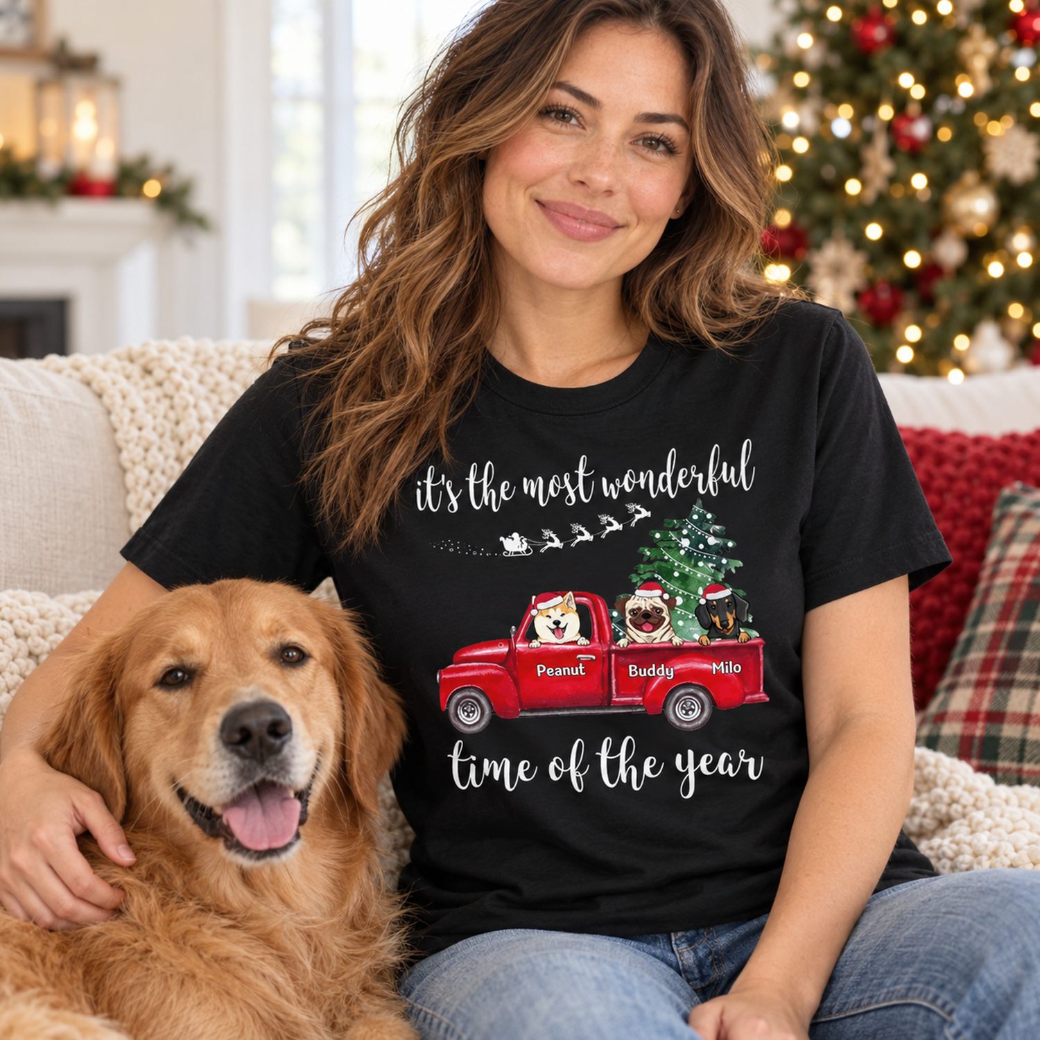 Dog mom wearing custom Christmas dog truck t-shirt on sofa near holiday tree