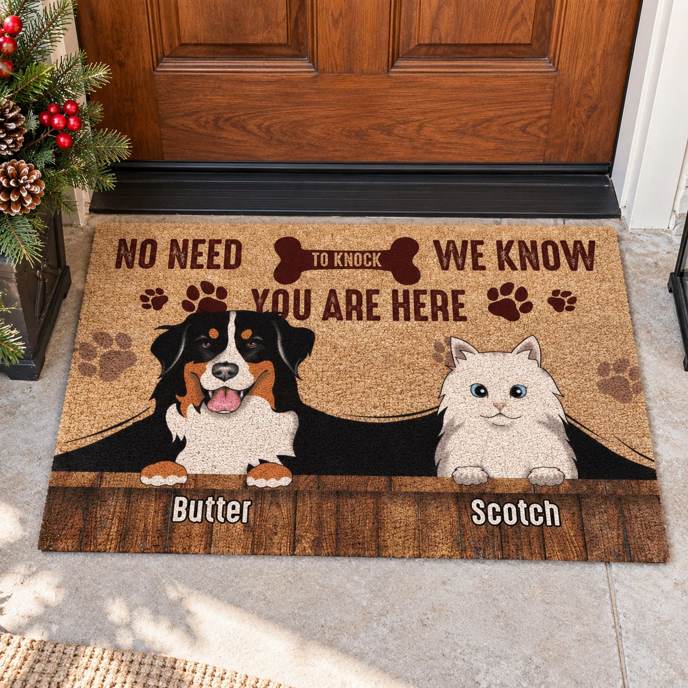 Personalized pet doormat at front door with winter greenery planter