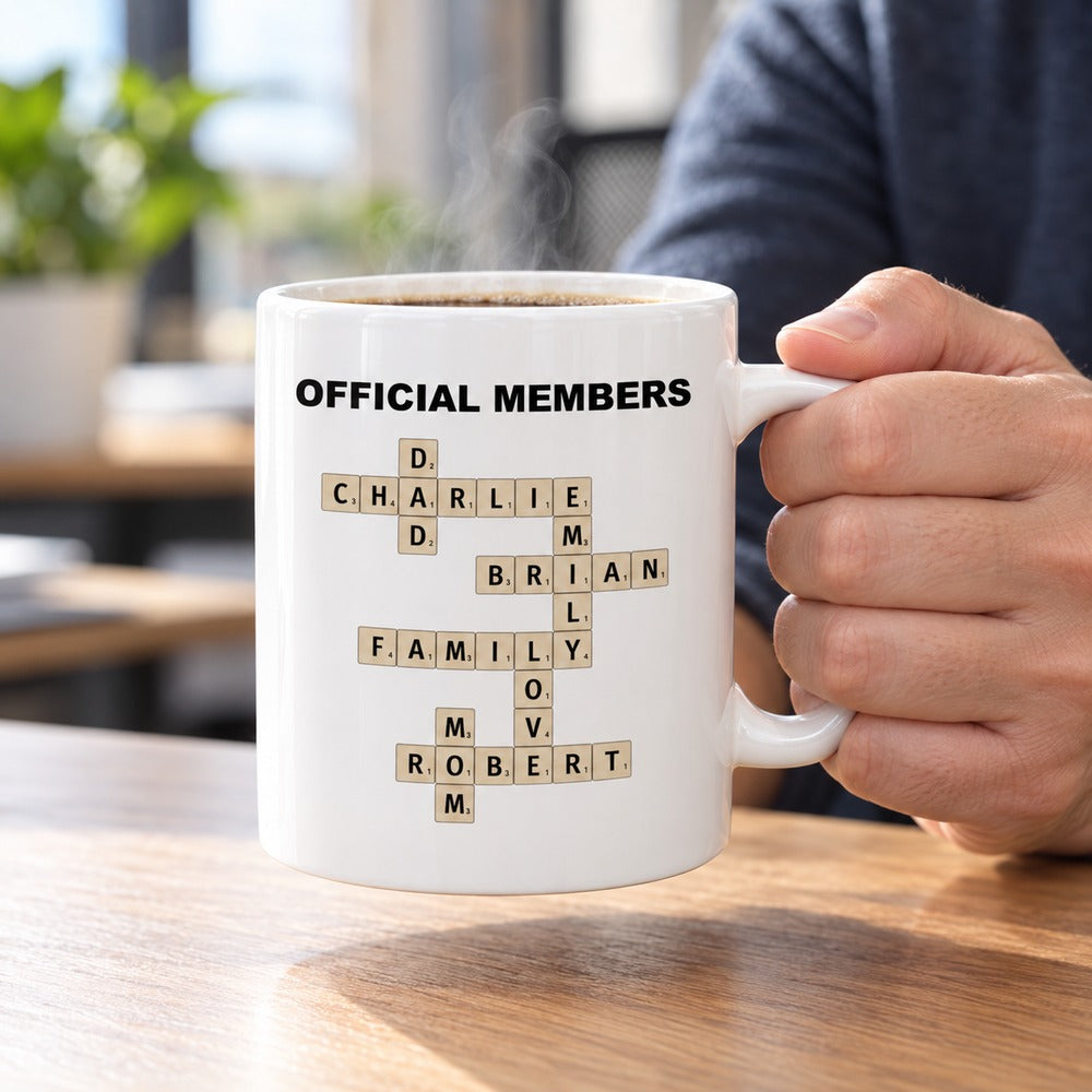 Coworker holding Official Members crossword personalized mug by the handle at a desk