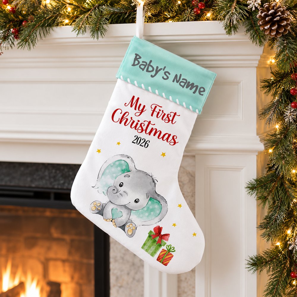 Elephant Baby First Christmas personalized stocking hanging on a decorated fireplace mantel