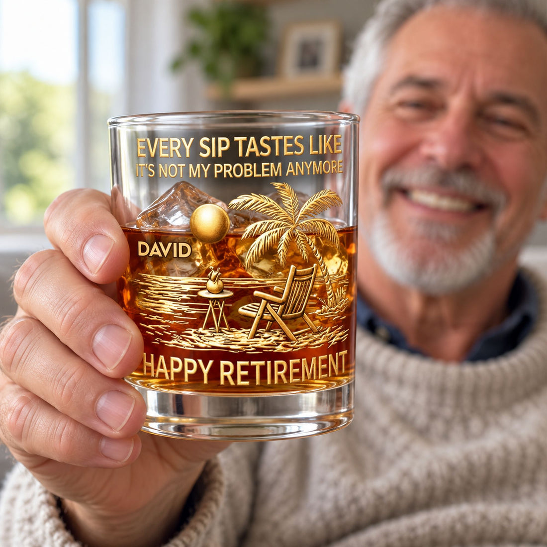 Retired man holding personalized Happy Retirement whiskey glass in bright living room