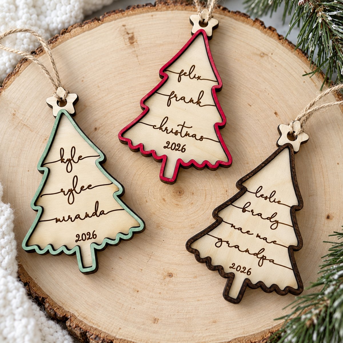 Macro closeup of laser engraved cursive names and 2-layer wood edge on Christmas ornament