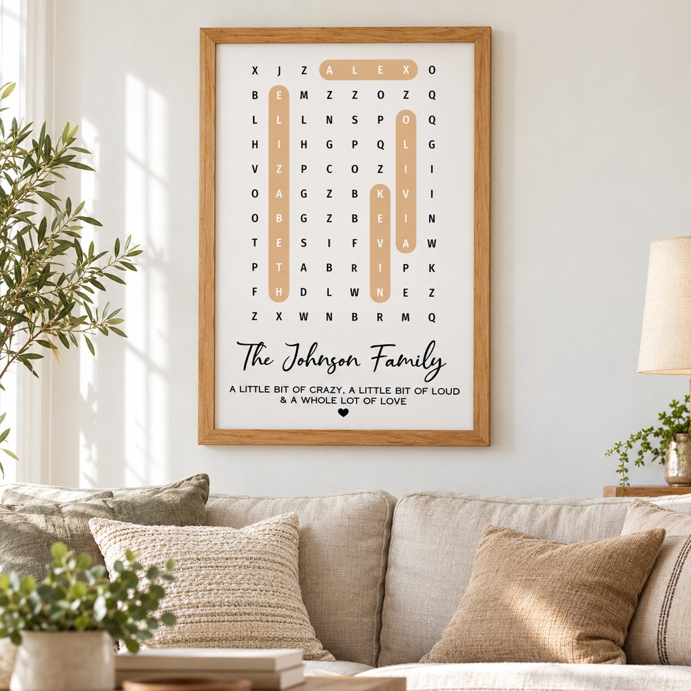 Family name word search puzzle framed poster hanging on living room wall above sofa